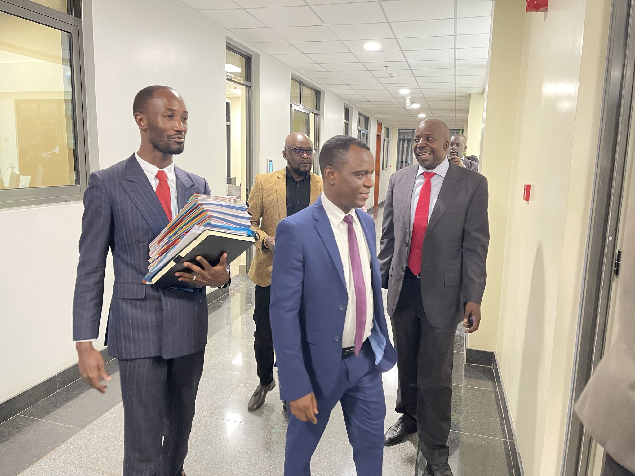 Dr Frank Mugish with a team lawyers at the supreme court.